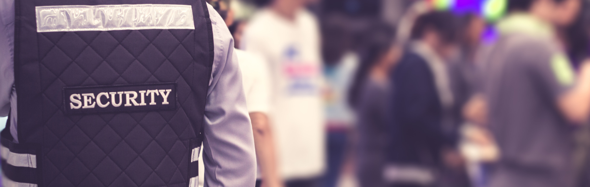 security officer looking at travelers