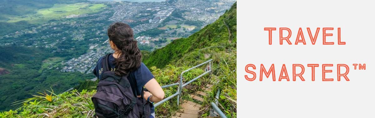 travel smarter text with woman looking at a city from above