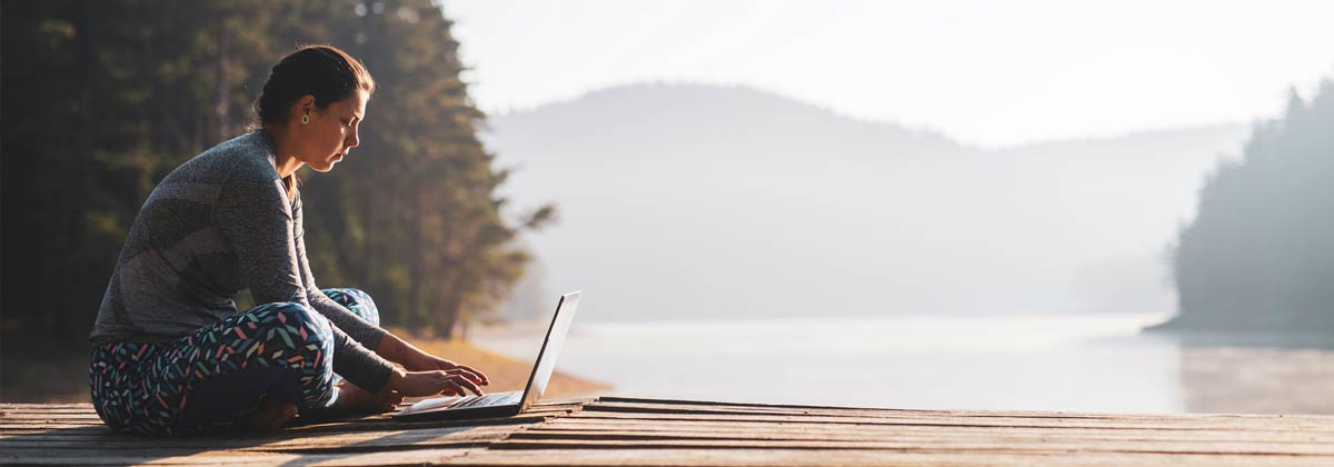 woman typing on a laptop