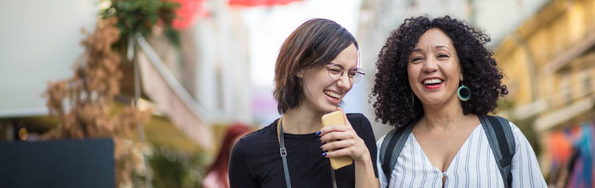 women walking together and laughing