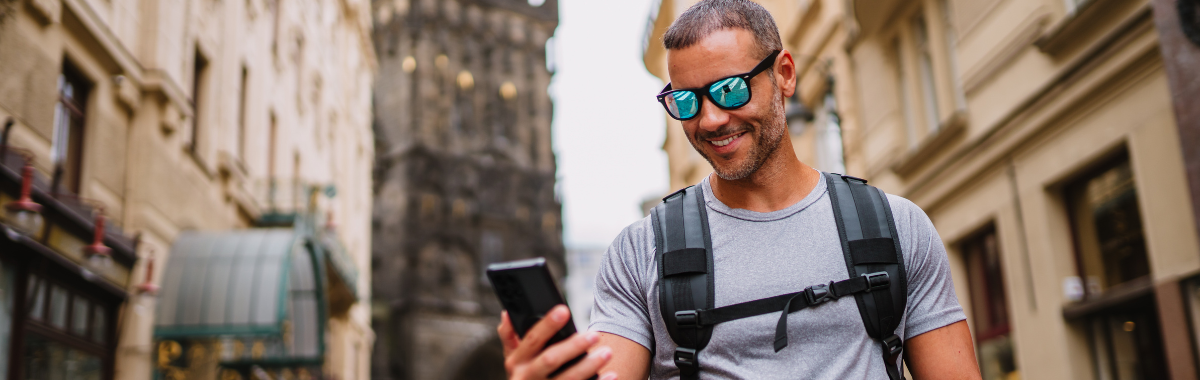 man smiling at his phone