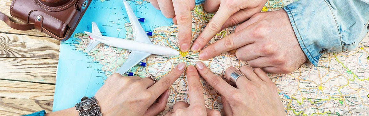 map and fingers pointing to Europe