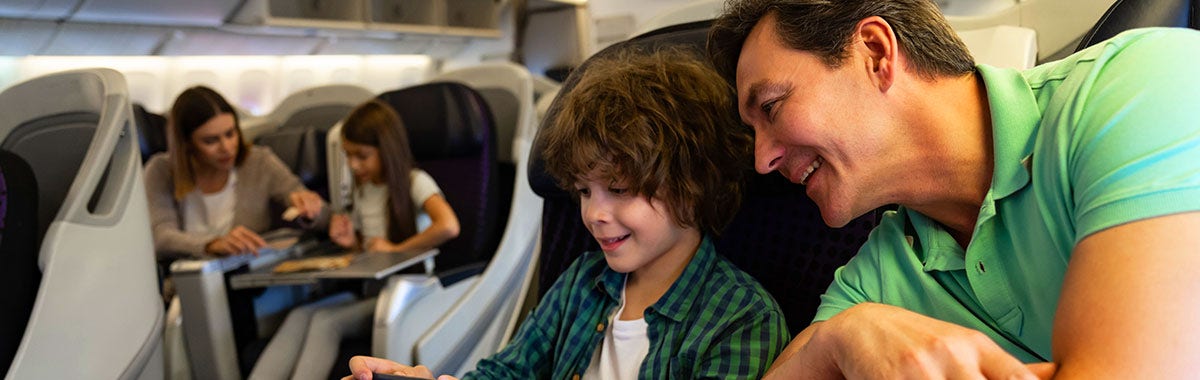 family talking to each other on a plane