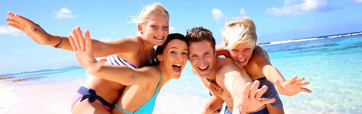 family having fun on the beach