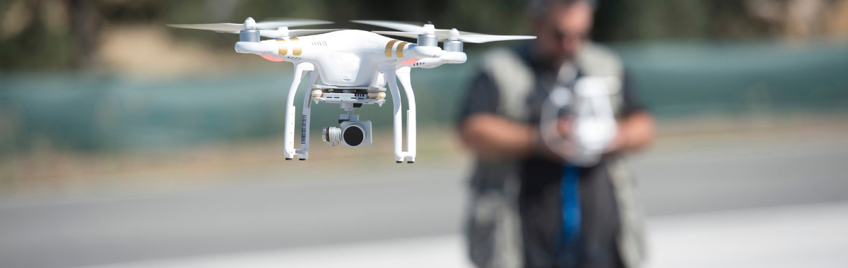 drone with its operator behind it