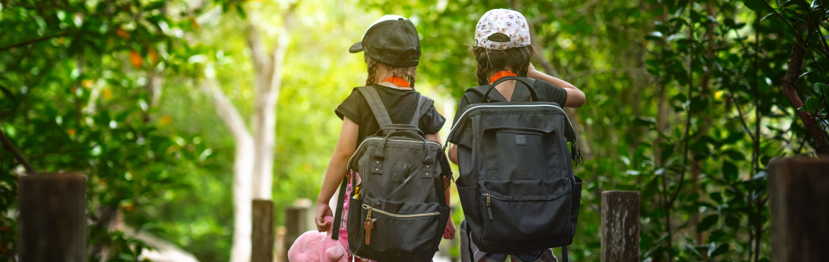 kids walking together with backpacks