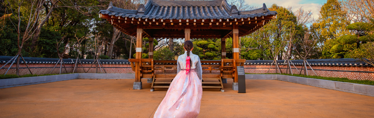 traditional korean shrine maiden infront of shrine