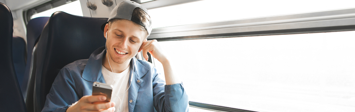 man smiling at his phone