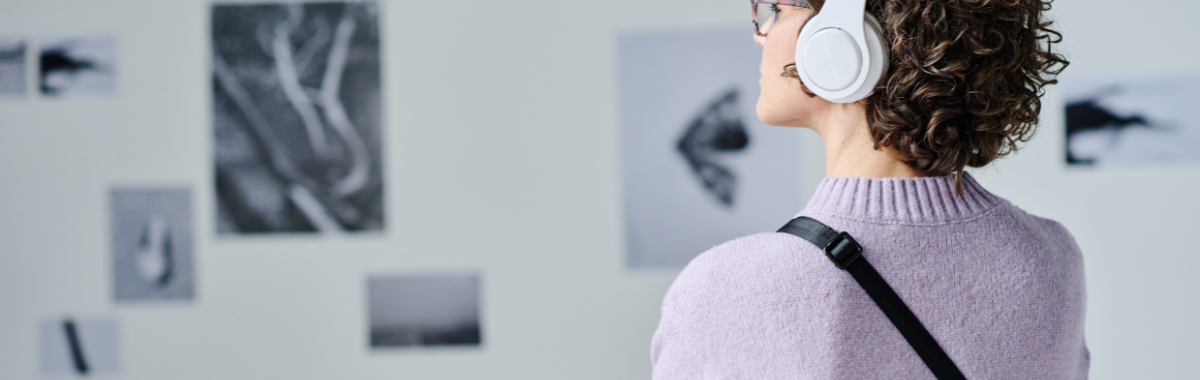 woman looking at art in a museum
