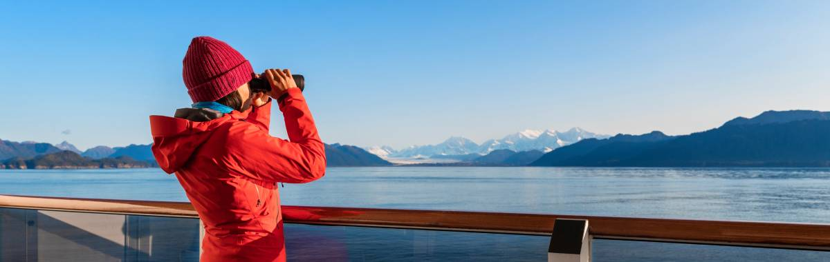 woman on a cruise using binoculars