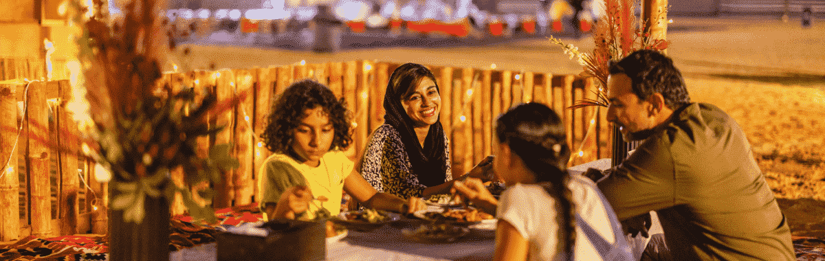 family eating dinner together outside