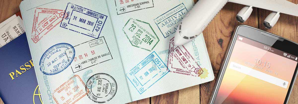 passport, international travel insurance papers, phone and a model plane