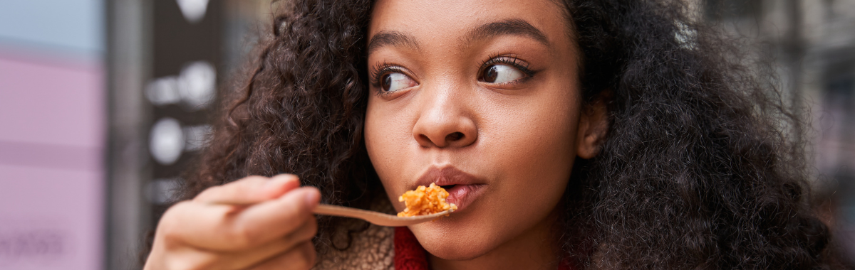 woman eating a new food 
