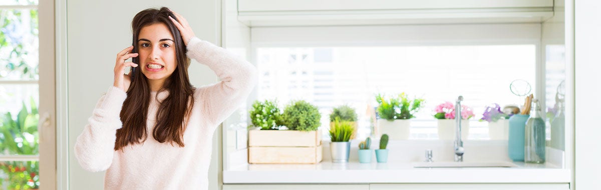 woman on the phone looking frustrated