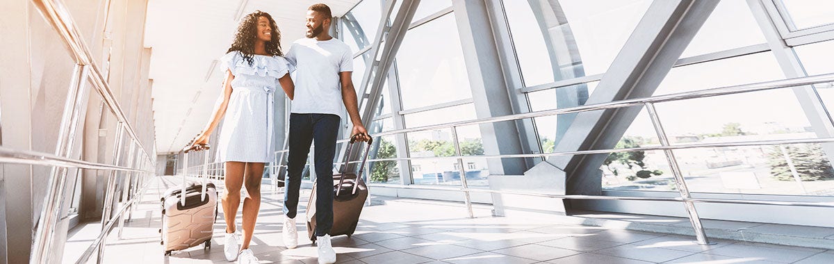 couple walking through airport together