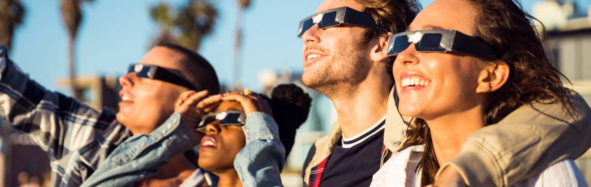 group of friends watching the eclipse