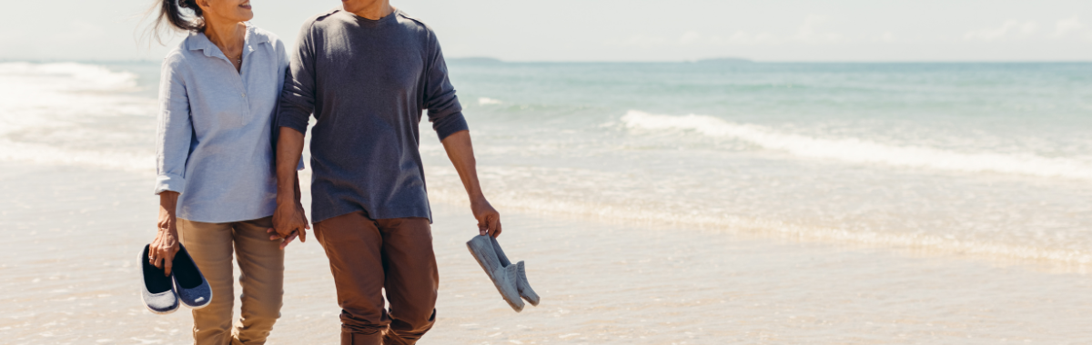 Senior couple walking on a beach