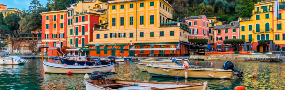 boats in the water outside italian town