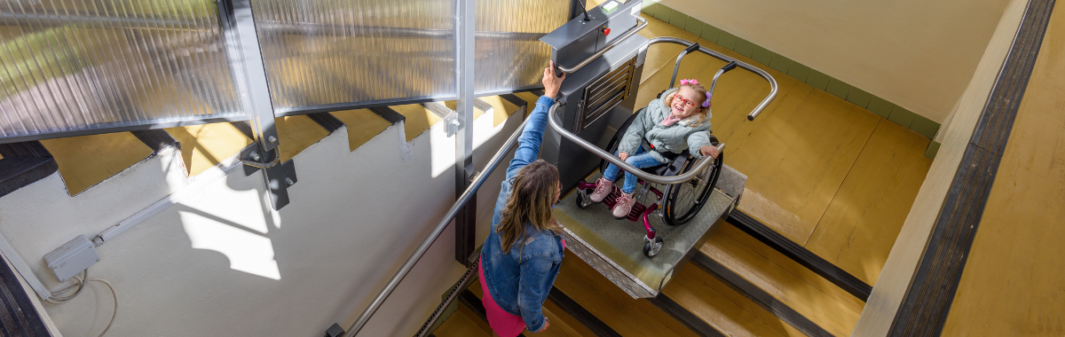 a wheelchair lift being used to go up stairs