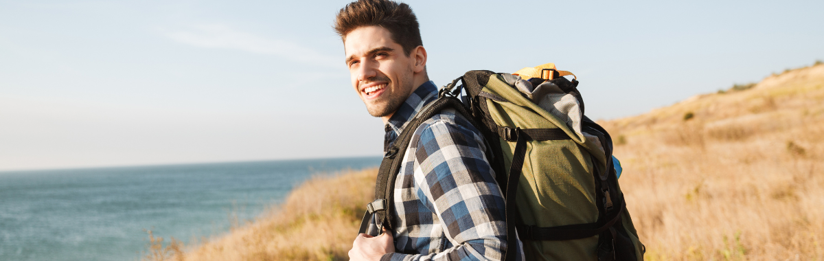 man backpacking