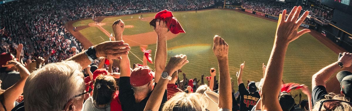 baseball fans cheering in a stadium