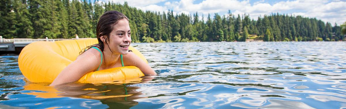 girl in a floaty in a lake