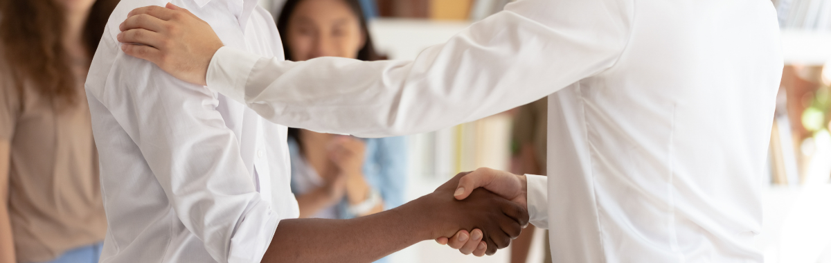 boss and employee shaking hands