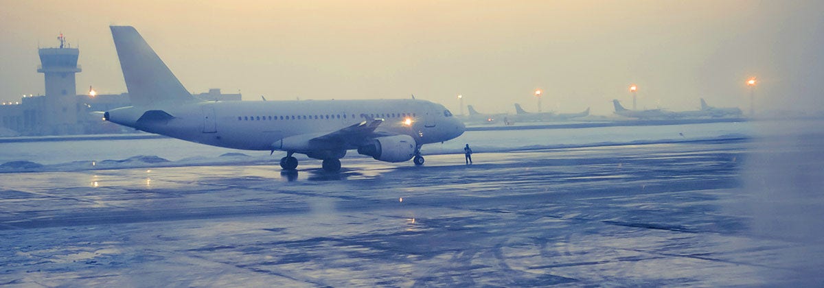 plane on the runway in a storm