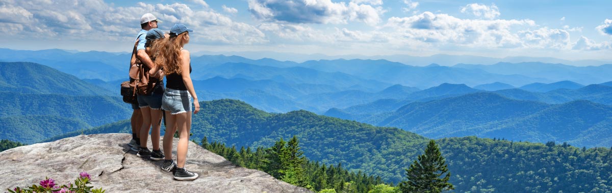 mountains with trekkers at the top