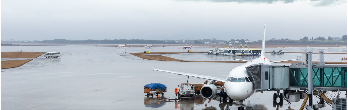 plane docked at airport due to bad weather