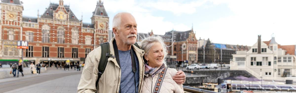 senior couple exploring a city in europe