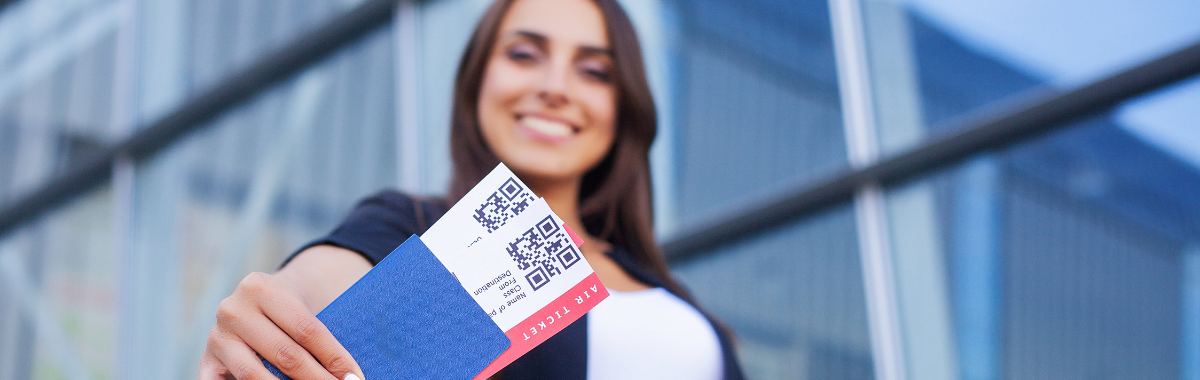 woman holding plane tickets