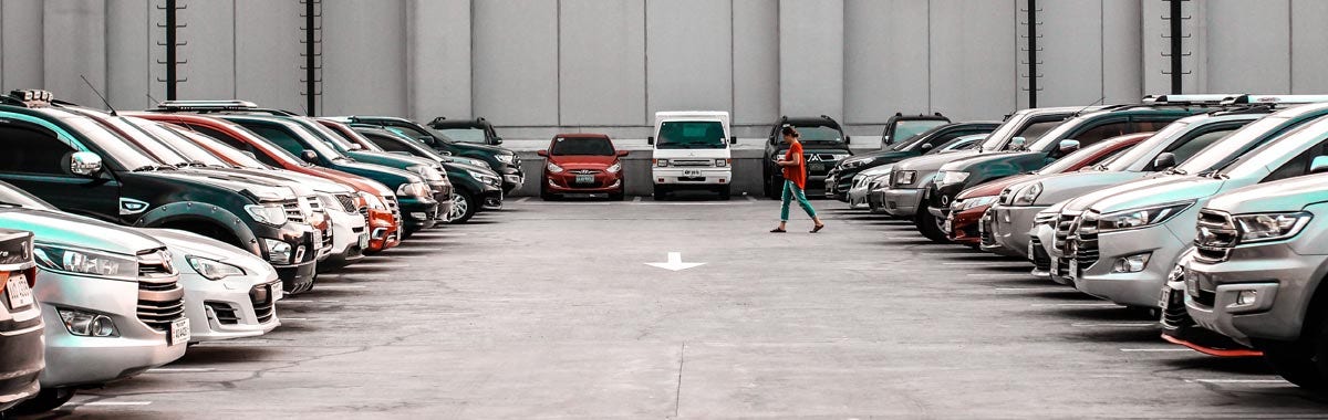 person walking in parking lot