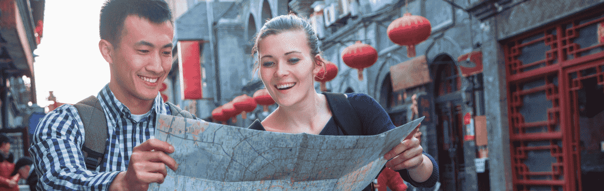couple looking at map together while exploring