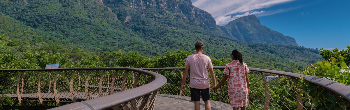 Couple walking together in a botanical garden in Africa