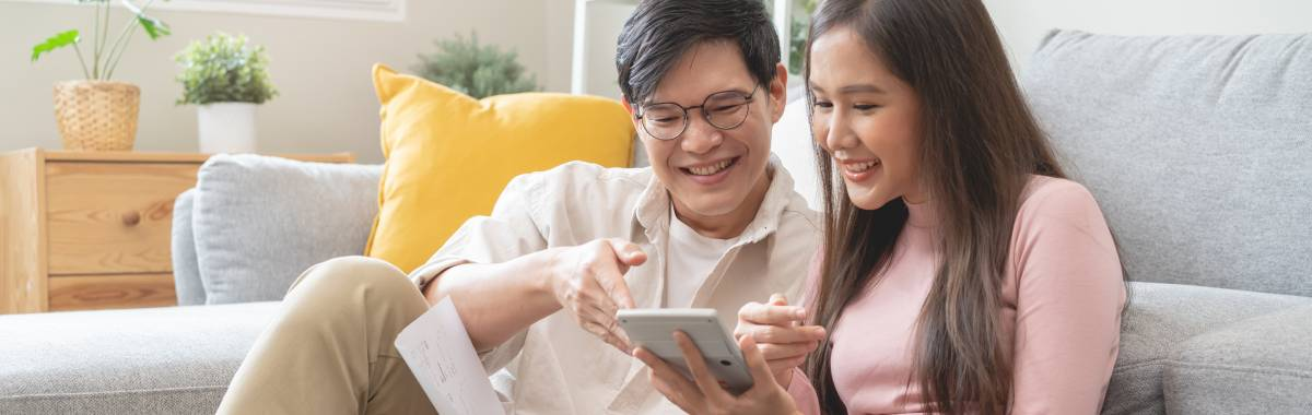 mother and daughter looking at an ipad