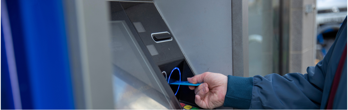 someone using an ATM