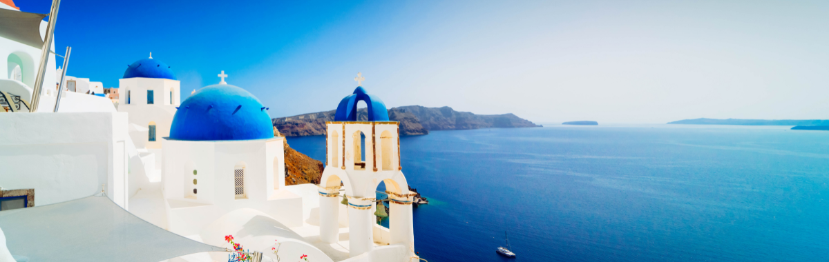 white buildings with blue tops in Greece