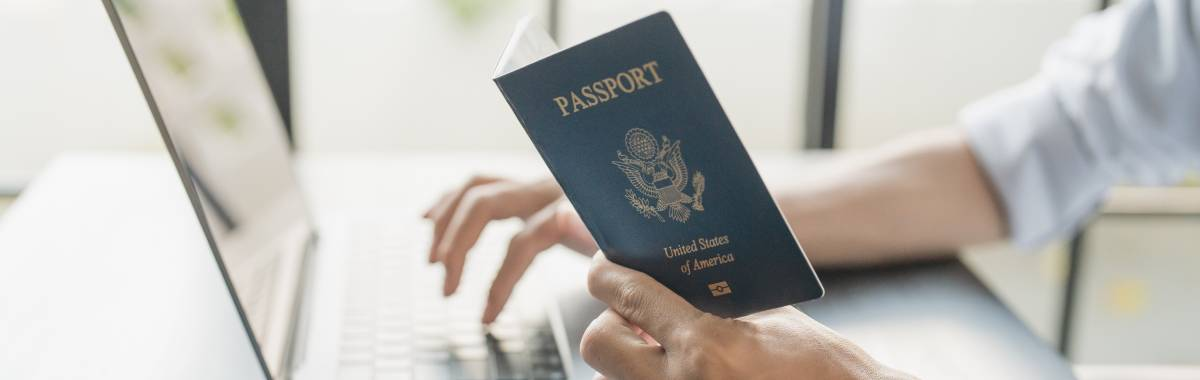 passport next to a laptop ready to be renewed