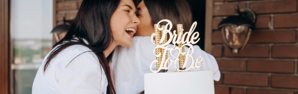 woman with a cake that reads bride to be