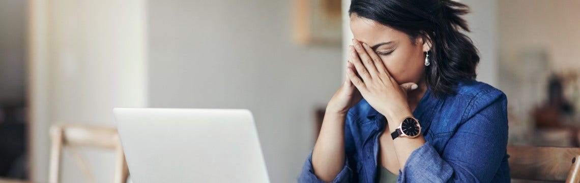 person upset on a computer