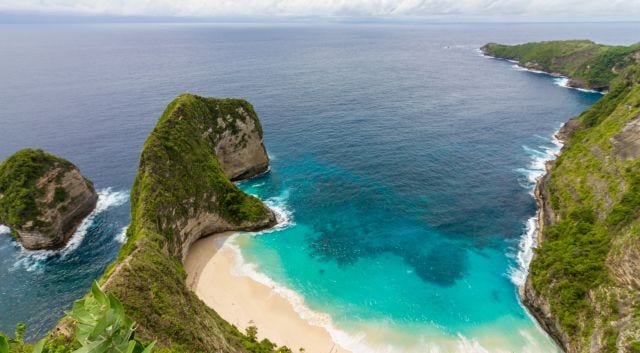 woman with beret looking at the Eiffel Tower in Paris, France
