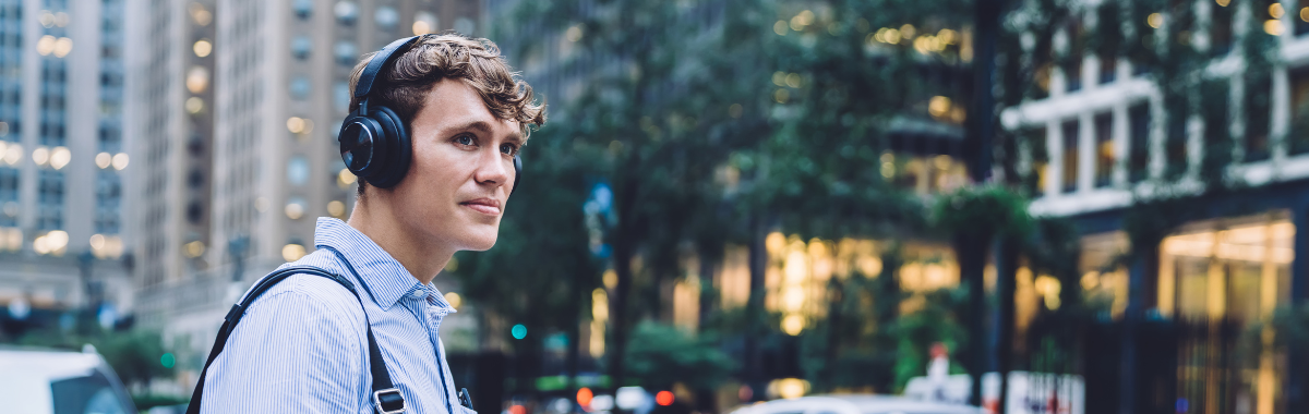 man wearing noise canceling headphones