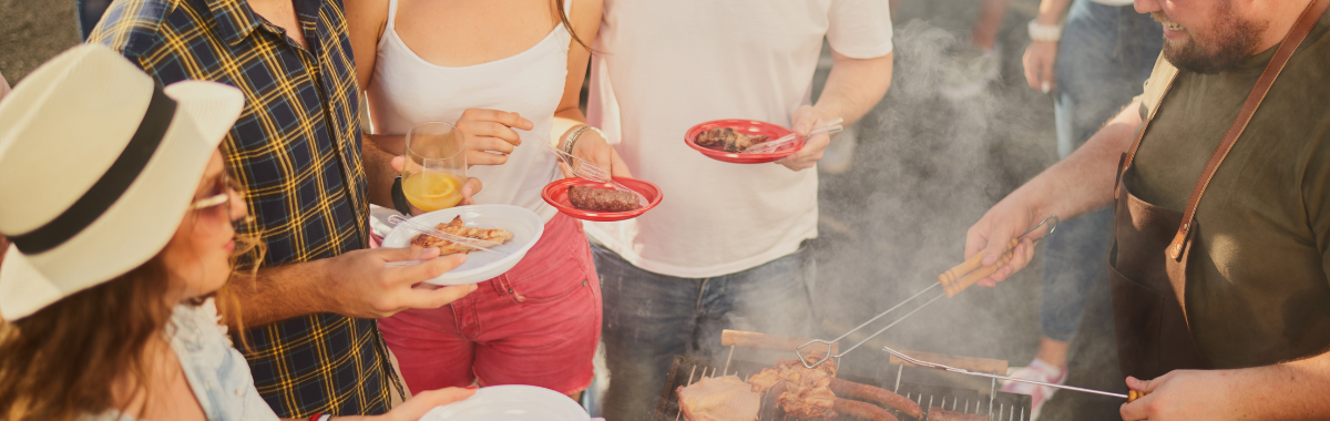 people gathered around a barbecue