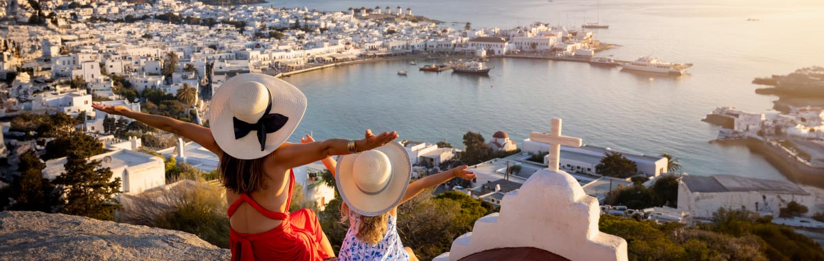 mom and daughter enjoying a luxurious sunrise on vacation