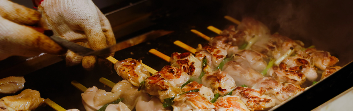 skewers being cooked 
