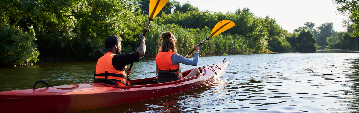 father and daughter kayaking together