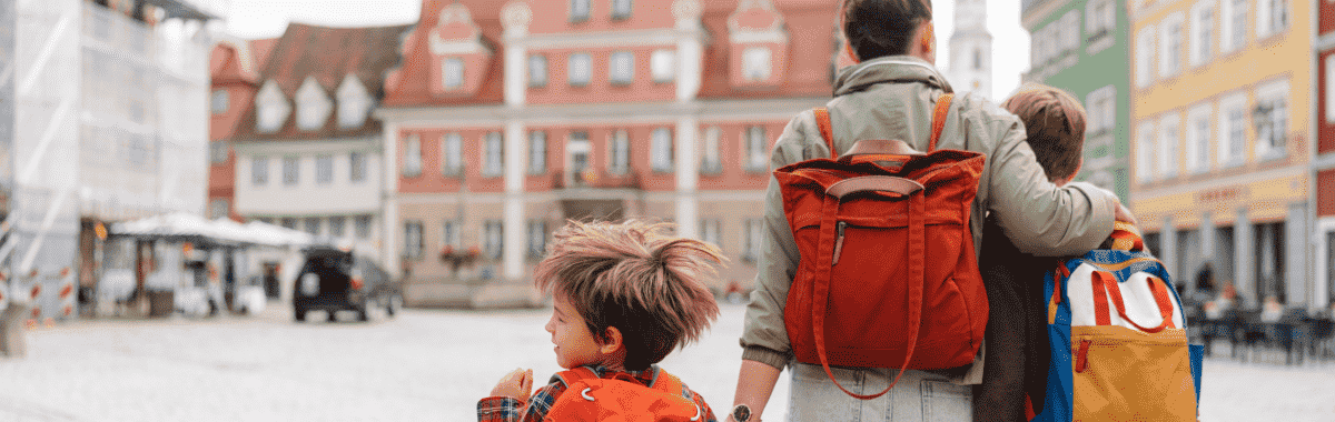 family walking around germany with their backs towards the camera
