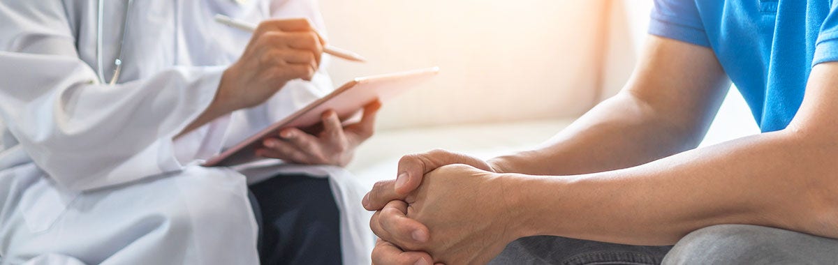 doctor talking to patient