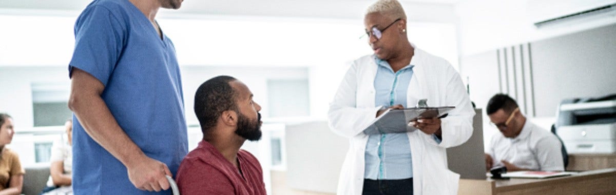 man on laptop at the beach